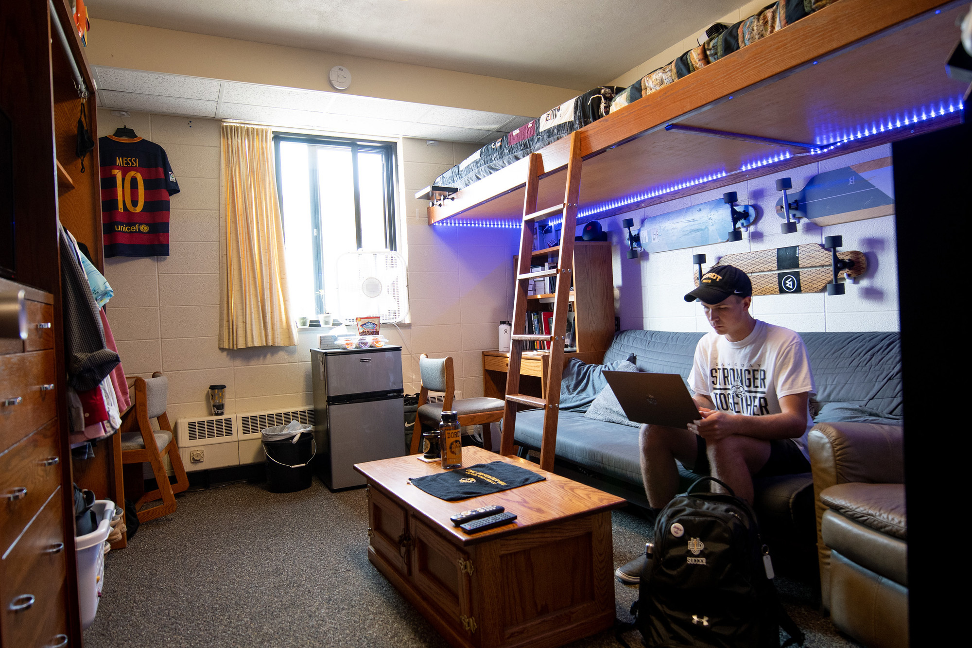 A Dordt student in his dorm room studying