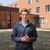 A Dordt student talking in front of a building