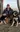 A picture of Braden Konyenbelt posing with his dogs