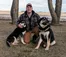 A picture of Braden Konyenbelt posing with his dogs