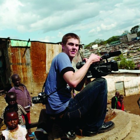 A picture of a man recording some footage