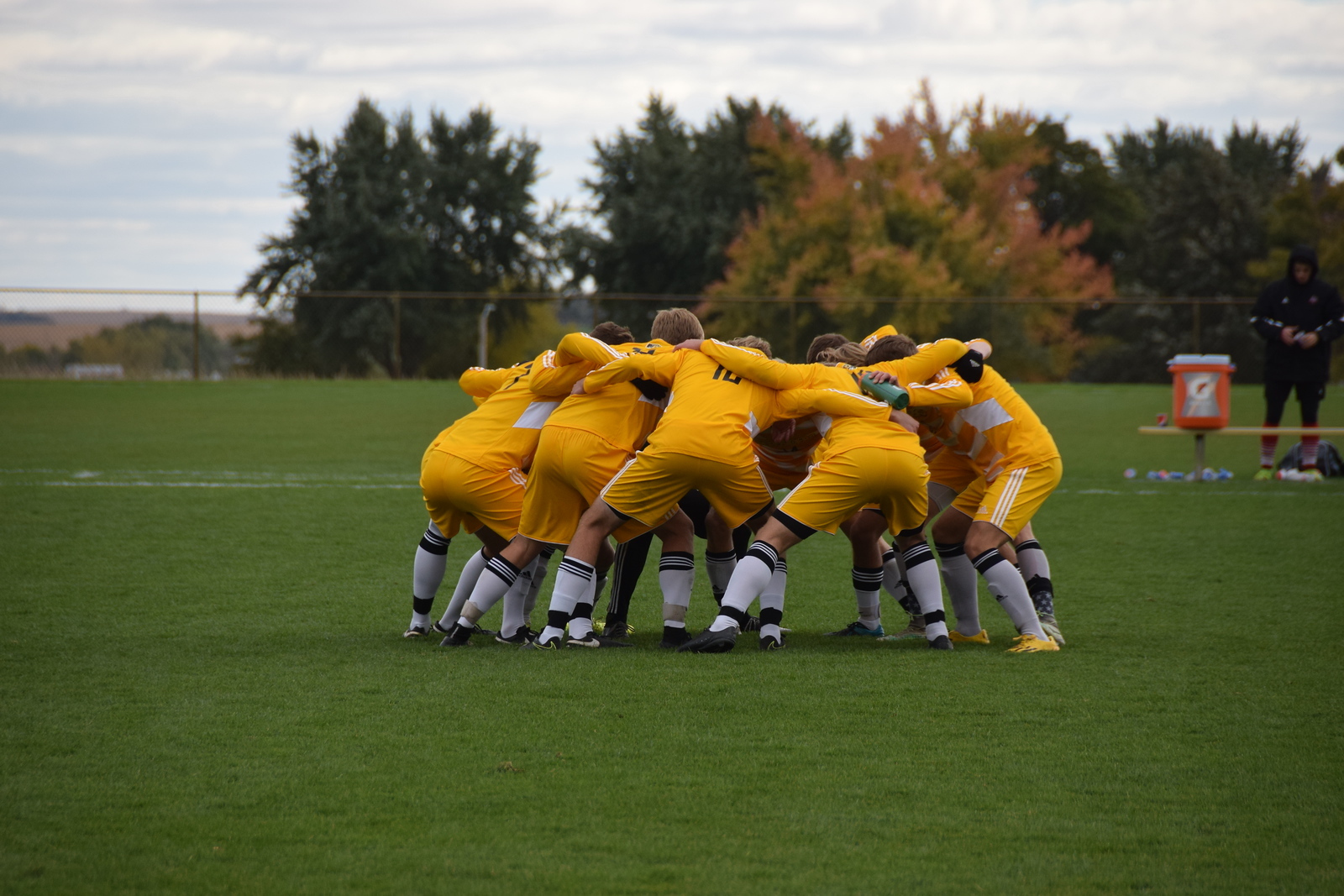 A picture of Dordt's soccer team during a huddle