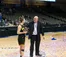 A Dordt basketball player gets a trophy