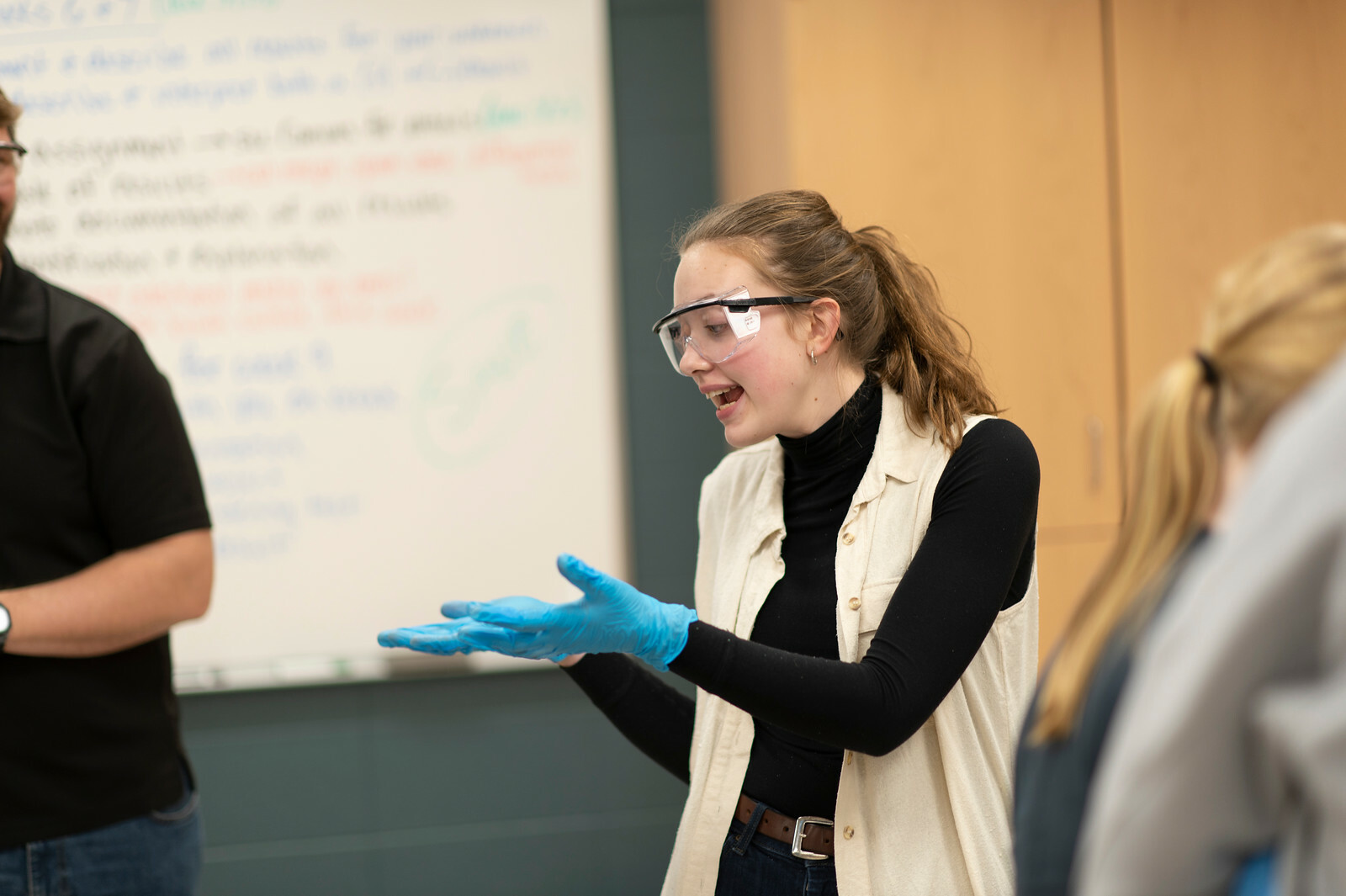 A student explains a point during a lab