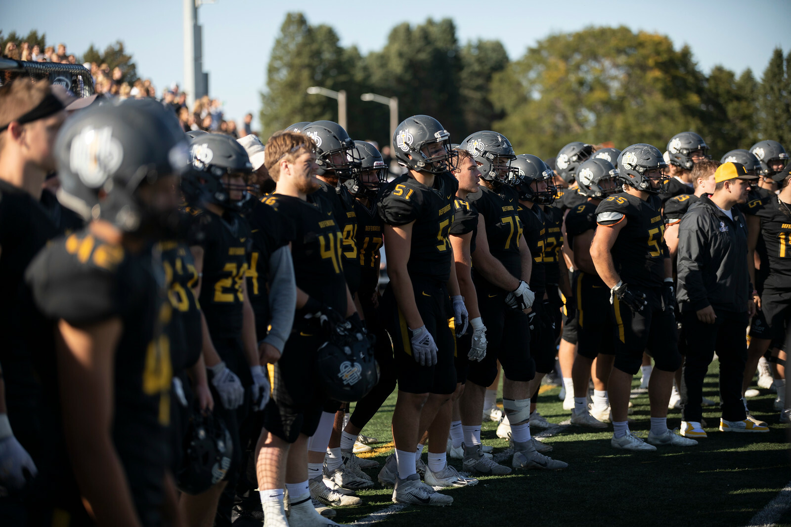 Dordt's football team gathers during a time-out