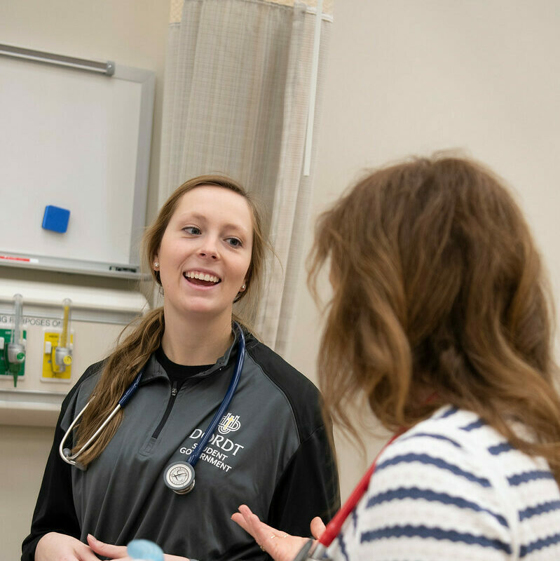 Two nursing students talk