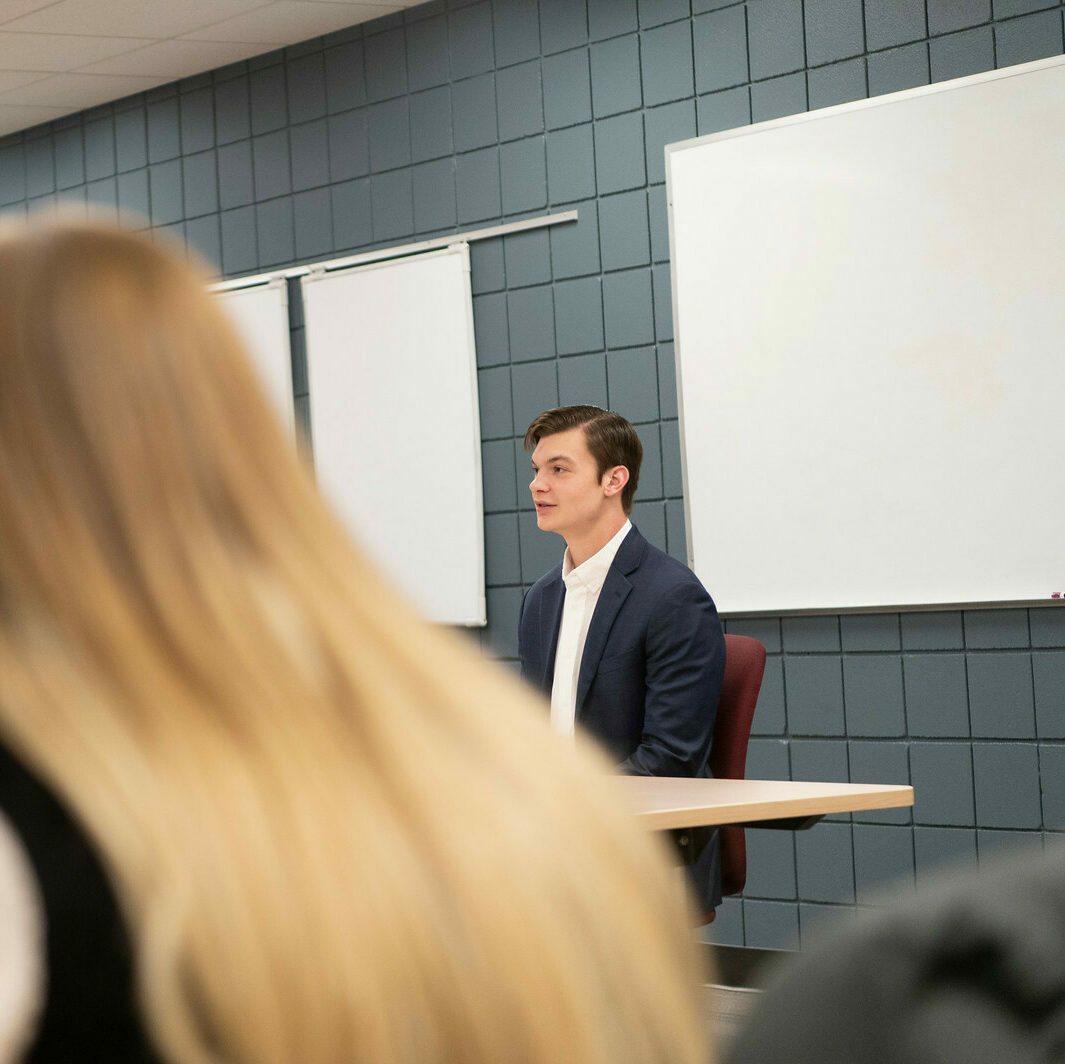 Male student speaks during class discussion
