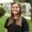 Smiling young woman outside