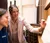 Female professor helps student learn music