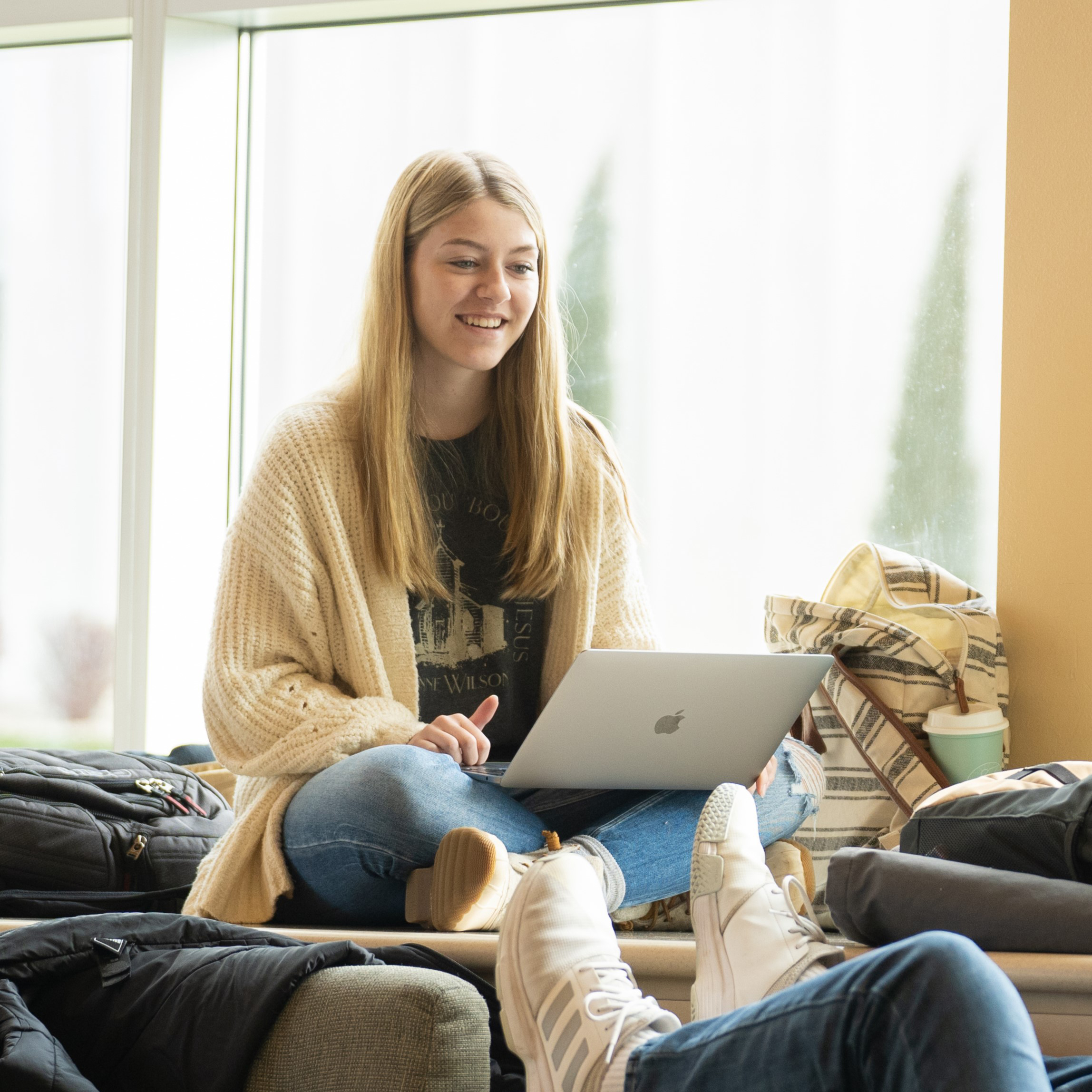 Female student sitting on her computer